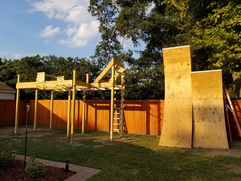 A completed wooden curved climbing wall